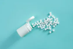 White pills on blue background