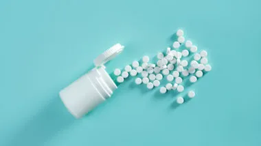 White pills on blue background