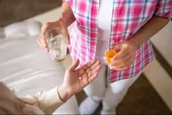 Woman taking medication