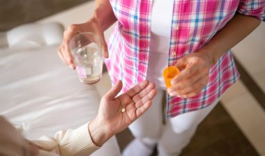 Woman taking medication