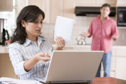 A woman is concerned about something in her bank statement.