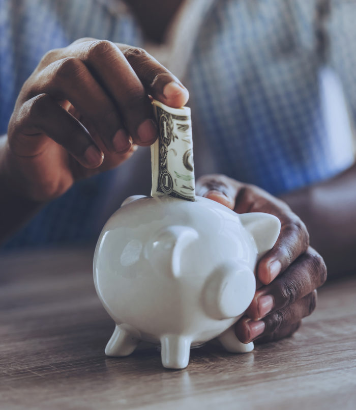 man saving money he received from a settlement check