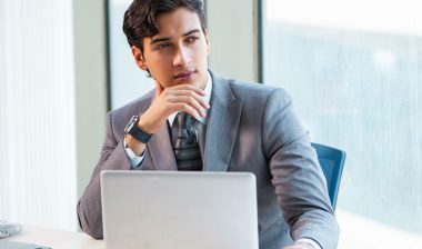 A man in an office looks concerned.