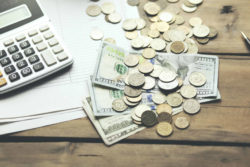 Money and calculator on papers