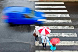 Pedestrians on crosswalk cut off by car