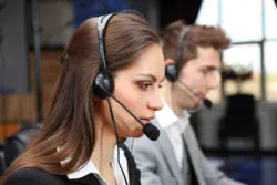A row of operators field phone calls.