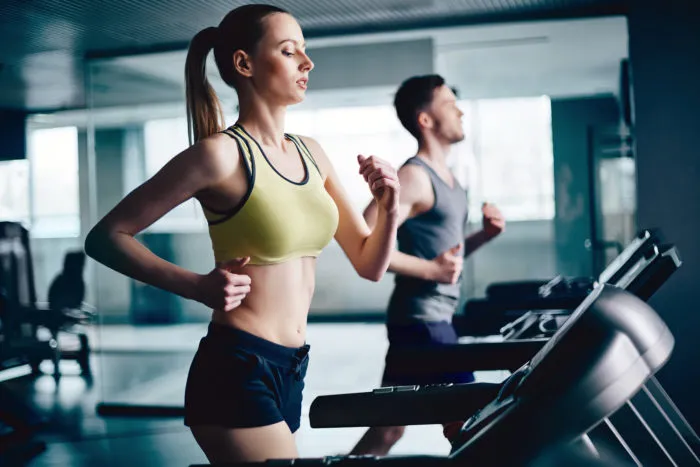 woman working out on treadmill at Snap Fitness