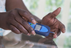 Closure up of woman taking blood sugar test