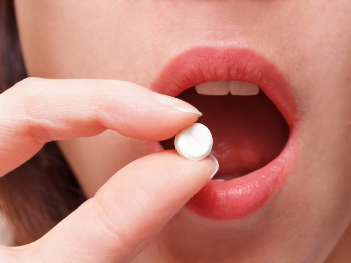 woman taking opioids