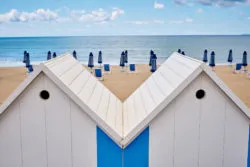 Two huts face the beach.