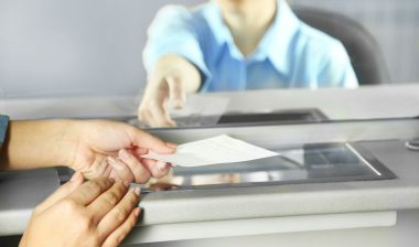 Close up of bank teller