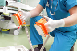 Doctor with defibulator