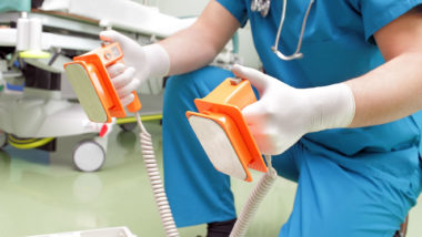Doctor with defibulator