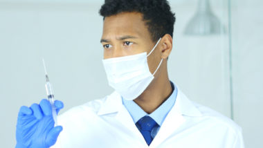 Doctor with injection