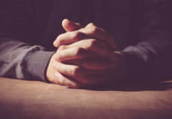 Two hands folded in prayer