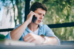 Frustrated young man on the phone