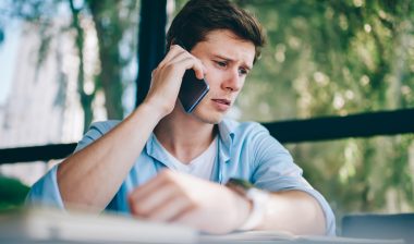 Frustrated young man on the phone