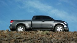 Gray truck against blue sky