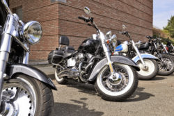 Motorcycles parked in line outside a building