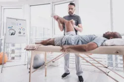 Man at physical therapy for knee pain.