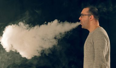 Man exhaling vape cloud