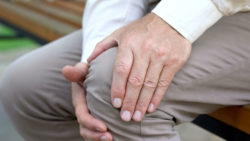 Man with sore knee
