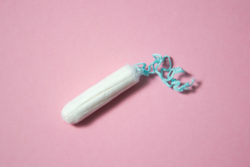 Tampon on pink background