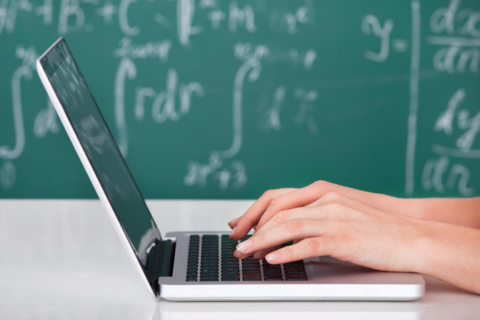 Devry university student on laptop