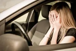 Woman in car after accident