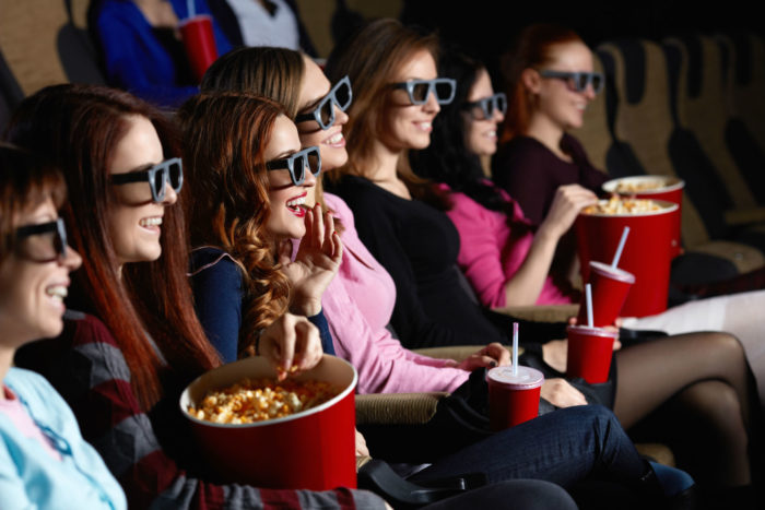 women with Sinemia subscription watching a movie