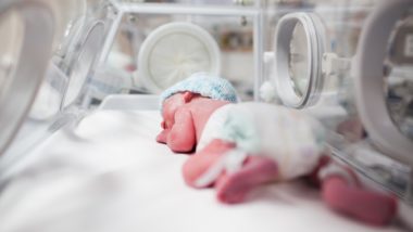 infant in incubator