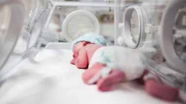 infant in incubator
