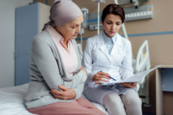 Cancer patient talking with doctor