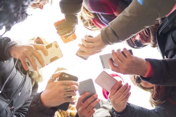 verizon and t-mobile phone customers holding phones