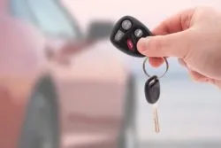 Keys to a red rental car