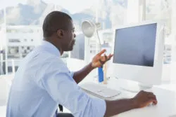 Man frustrated with slow computer