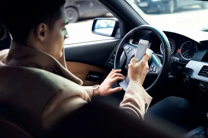 Man texting while driving