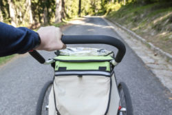 Man walking with jogging stroller