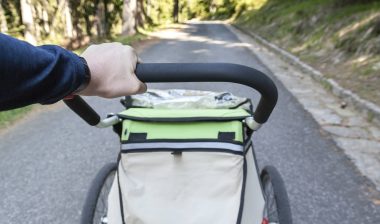 Man walking with jogging stroller