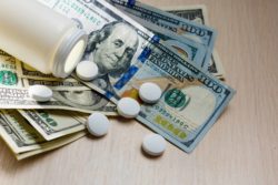Pills on hundred dollar bills