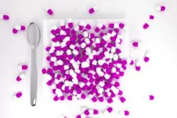 Purple pills on a white plate