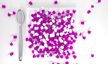 Purple pills on a white plate