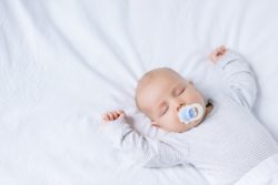 Sleeping baby on white