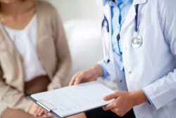 Woman at the doctor, medical card