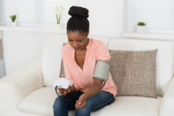 Woman taking blood pressure