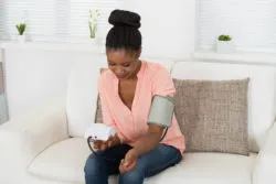Woman taking blood pressure