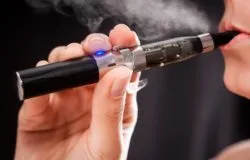 woman smoking e-cigarette
