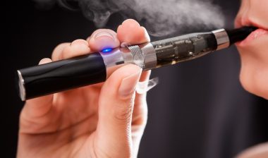 woman smoking e-cigarette
