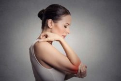 Woman with gout, elbow pain