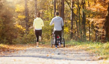 Young family running with jogging stroller